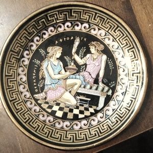 Small plate made in Greece. E M black 14kt gold 4.5 inches circumference